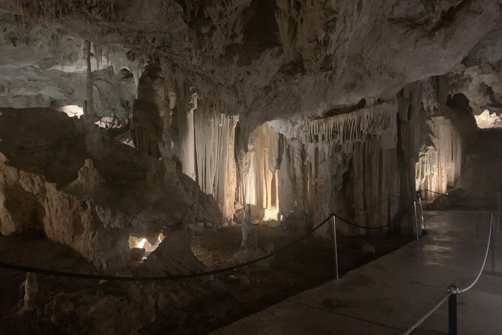 Nerja Cave in Spain, showcasing the impressive rock formations and stalactites in a natural setting