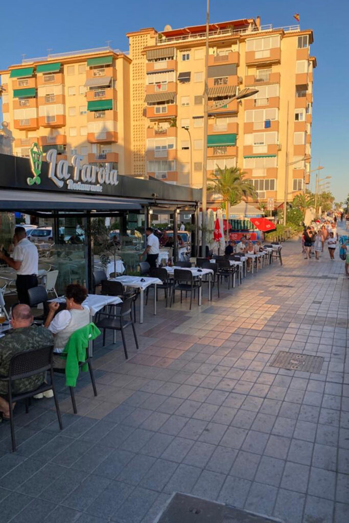 Restaurant La Farola in Málaga, Spain, featuring outdoor seating and the cozy atmosphere of the place