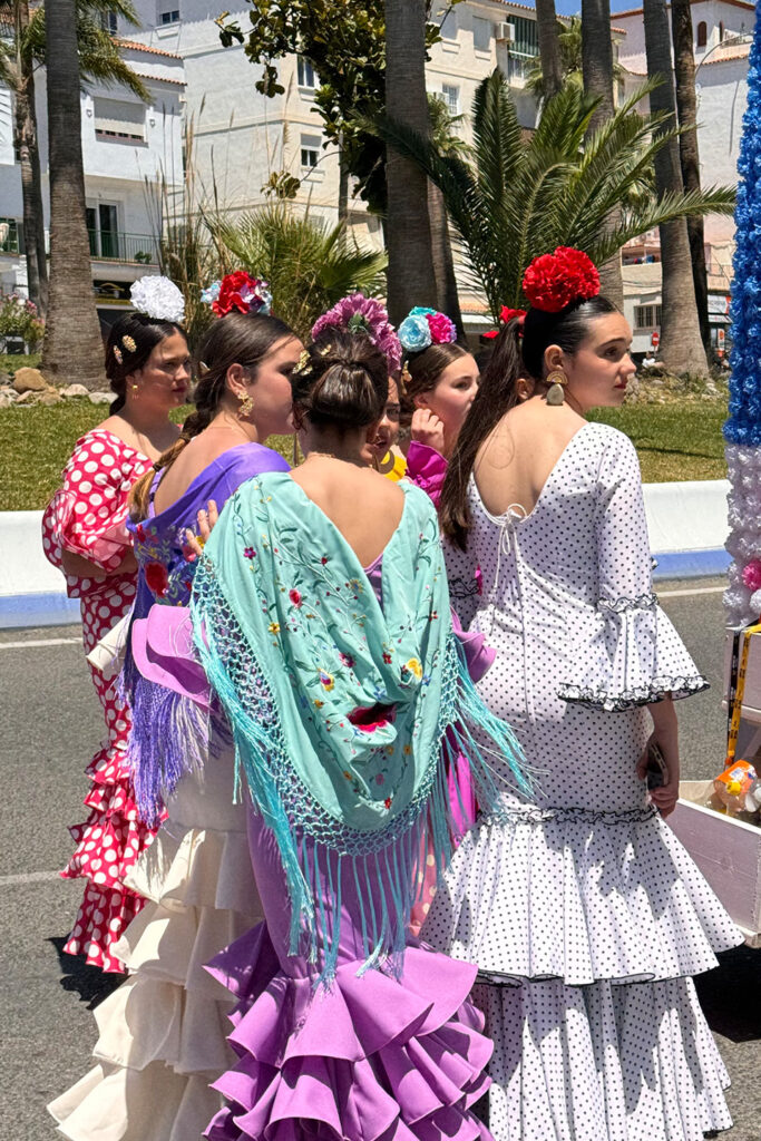 Dancers performing in a square in Nerja, Spain, showcasing an elegant performance in a picturesque setting